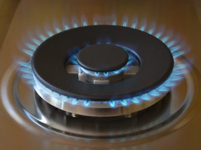 Double gas ring on a brand new gas stove, burning with a blue flame